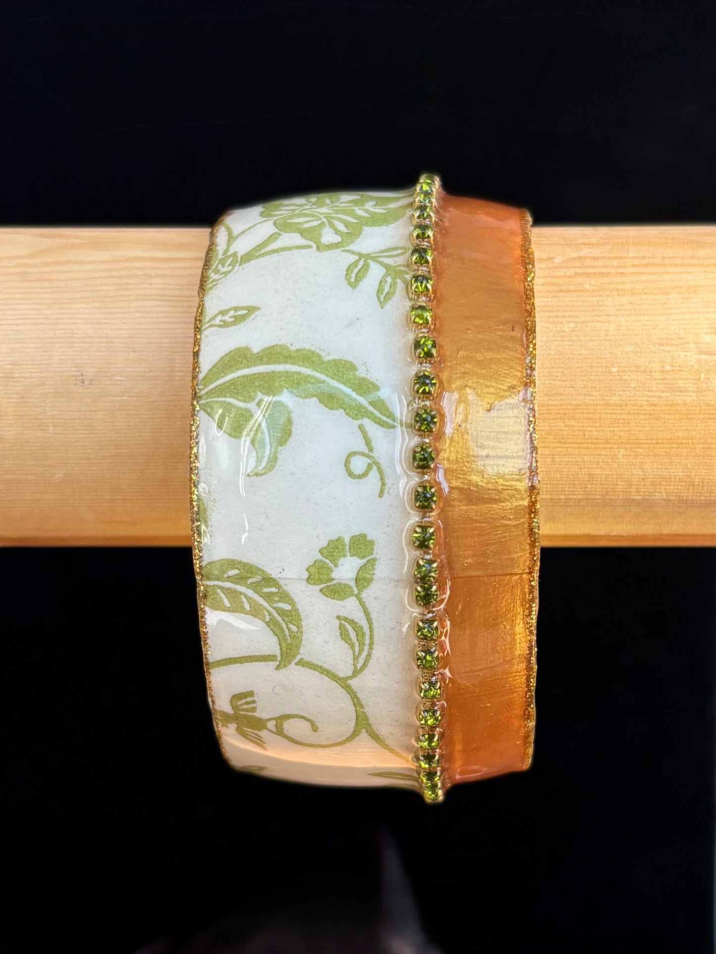Decorative bangle with green floral pattern by Iris Design