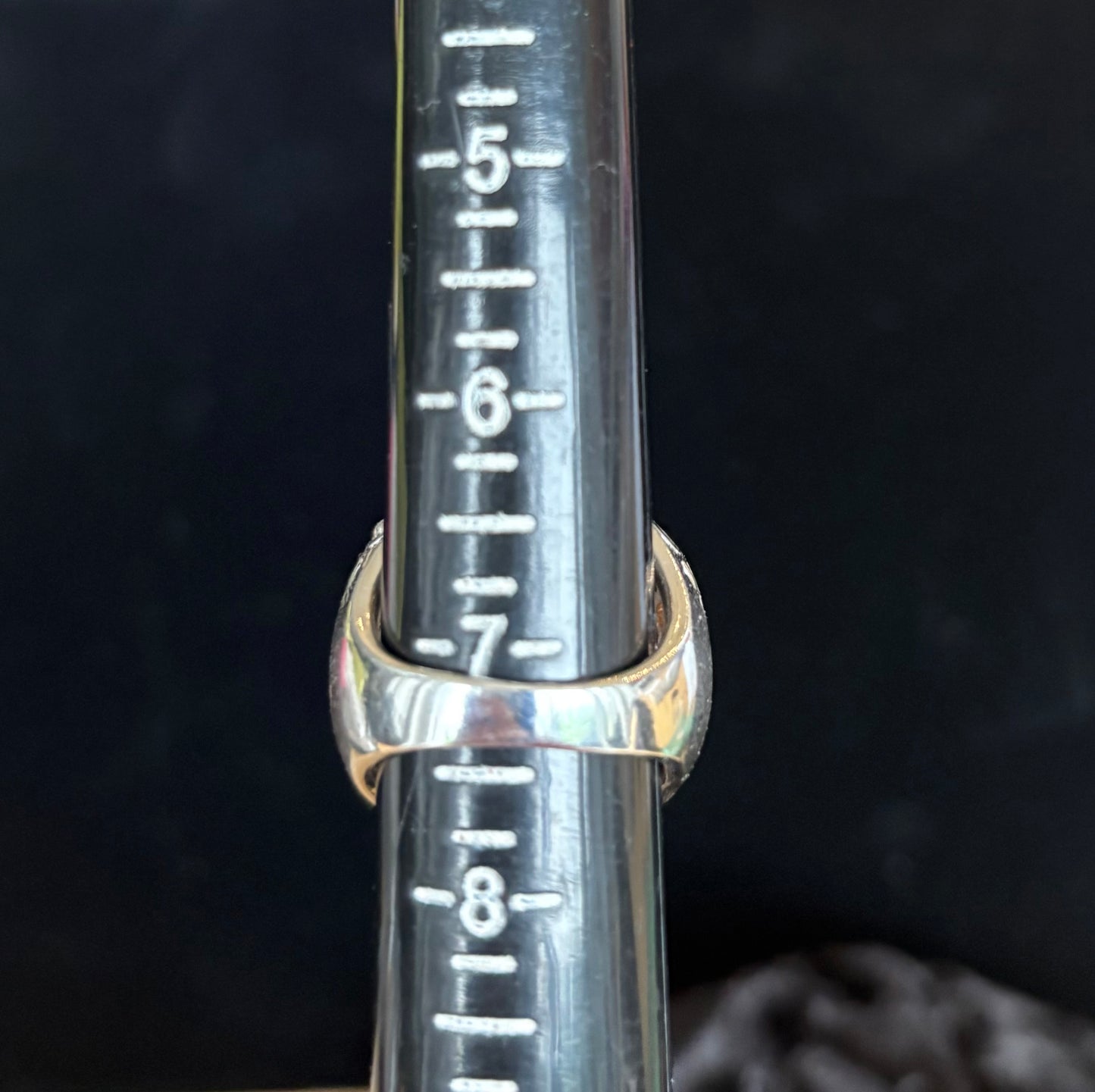 Ring measurement markings on a dark background