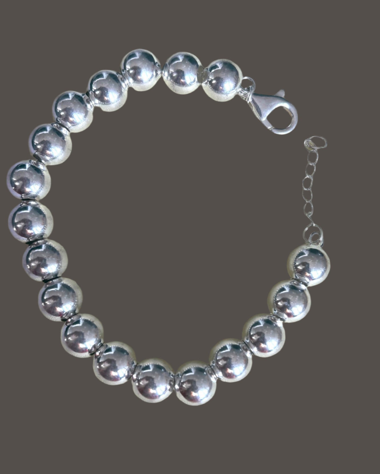 Sterling Silver beadedball bracelet on a grey background