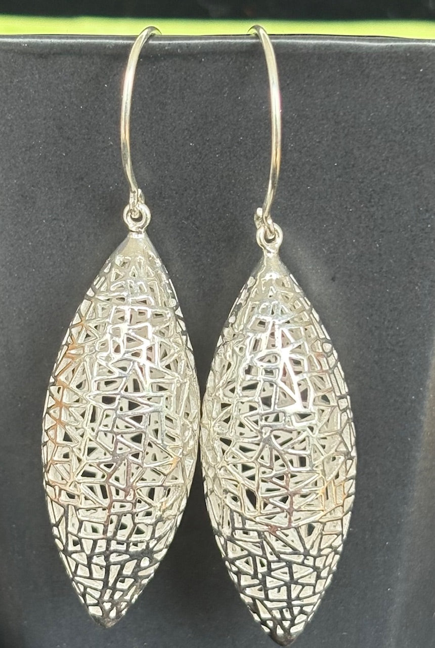 Jolie Esprit sterling silver filigree earrings on a black background