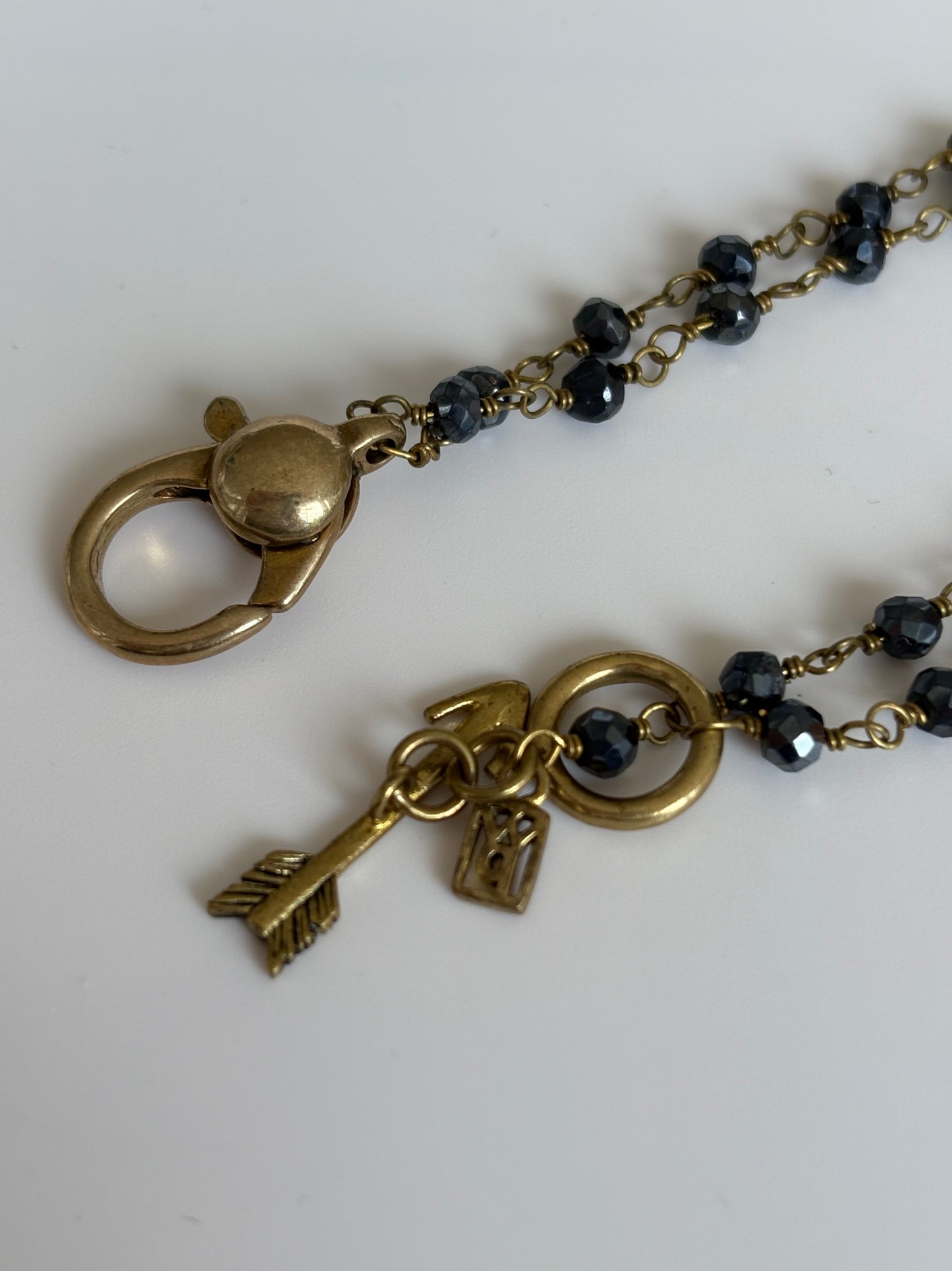 Necklace with brass clasp on a white background