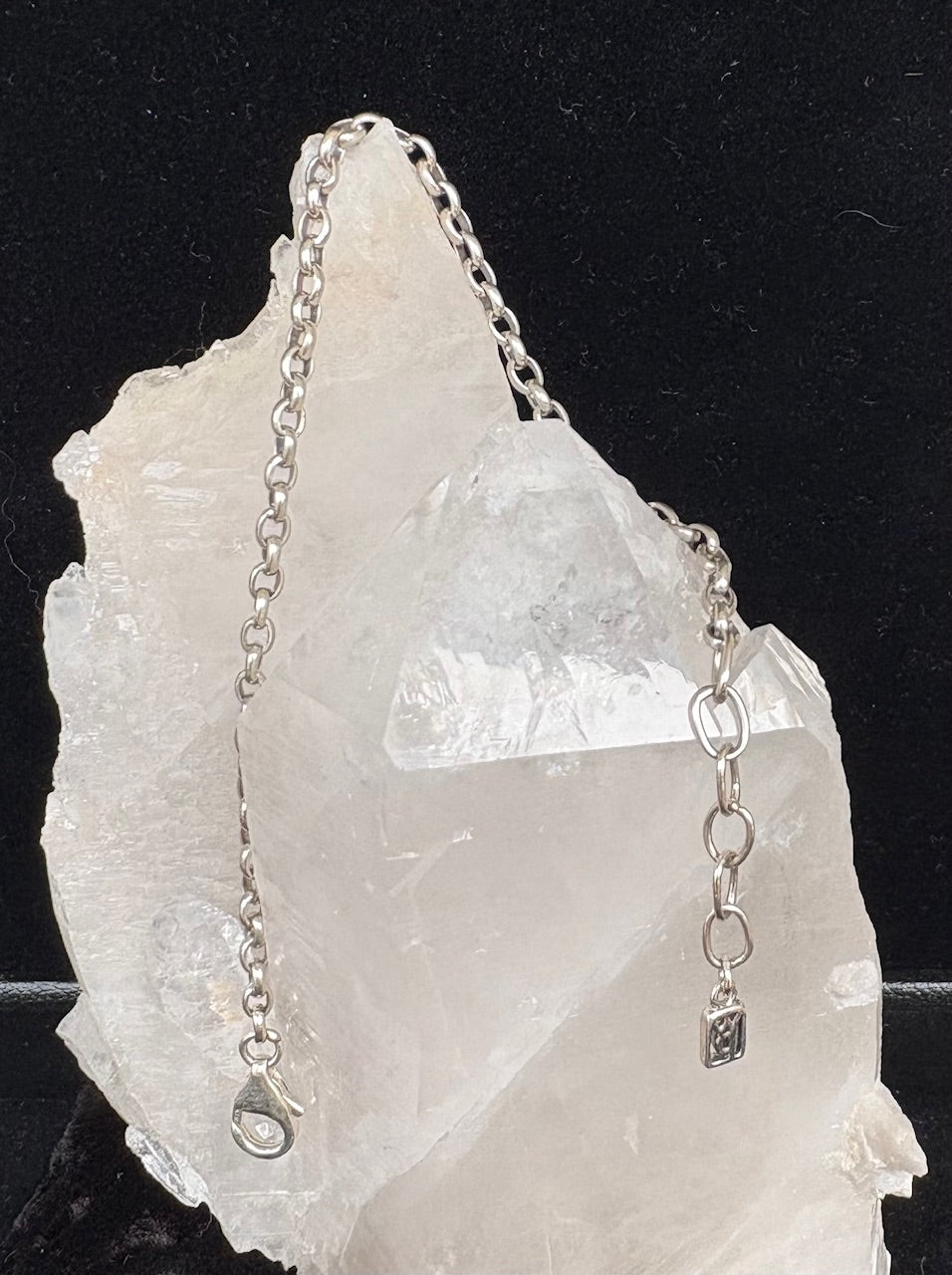 Waxing Poetic sterling silver chain bracelet on a crystal background