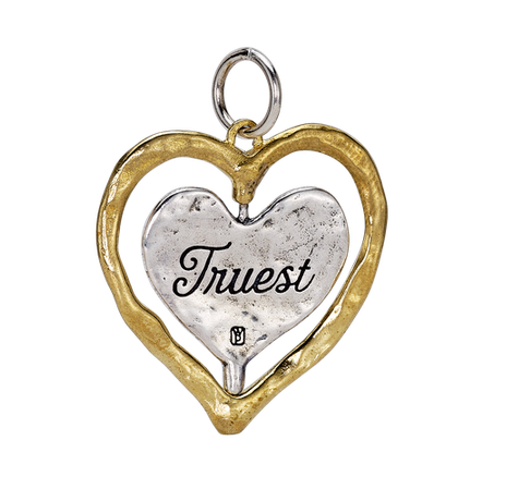 Waxing Poetic Heart-shaped pendant with 'Truest' engraved on a white background