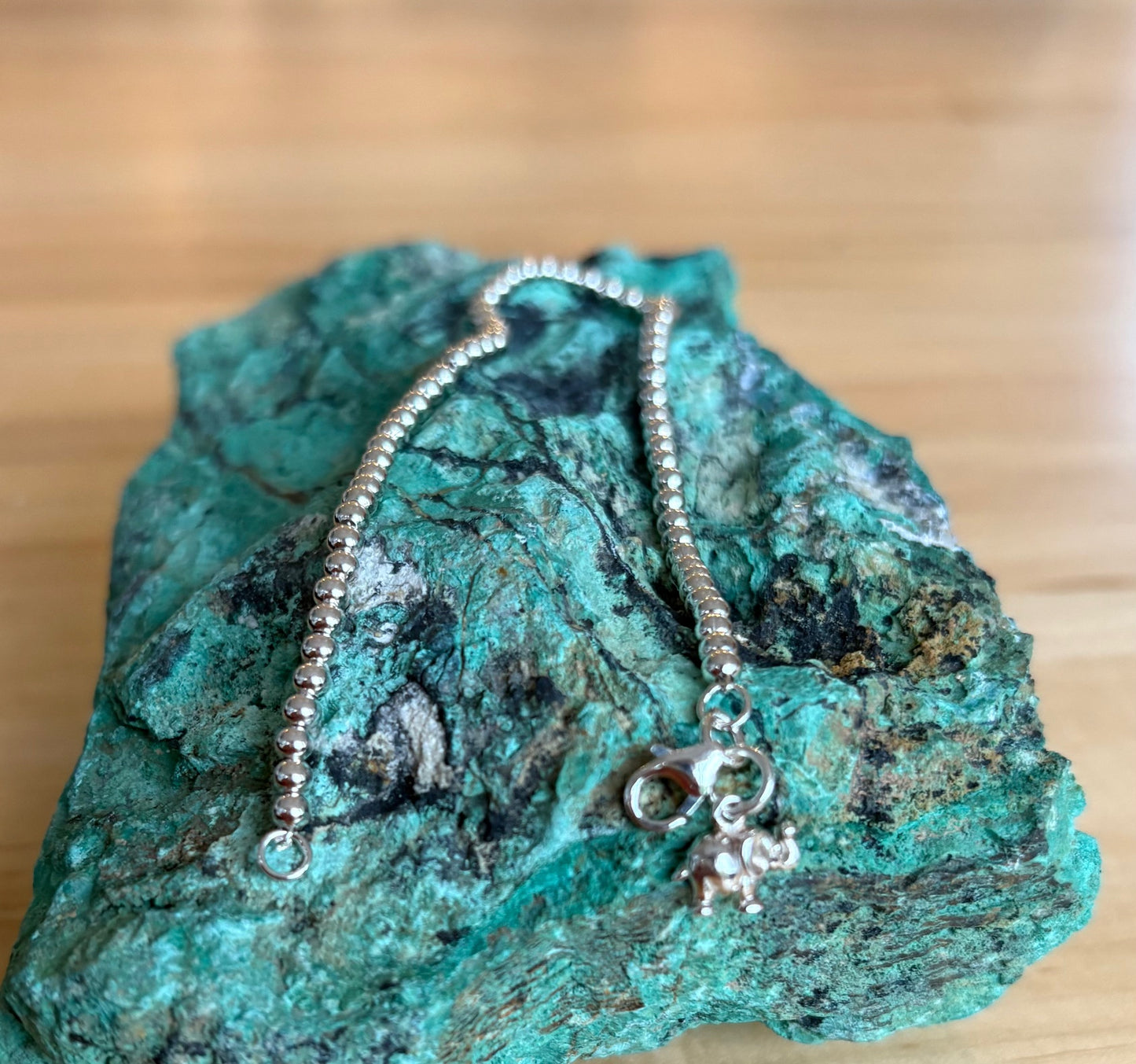 Silver bracelet with a pendant on a turquoise stone