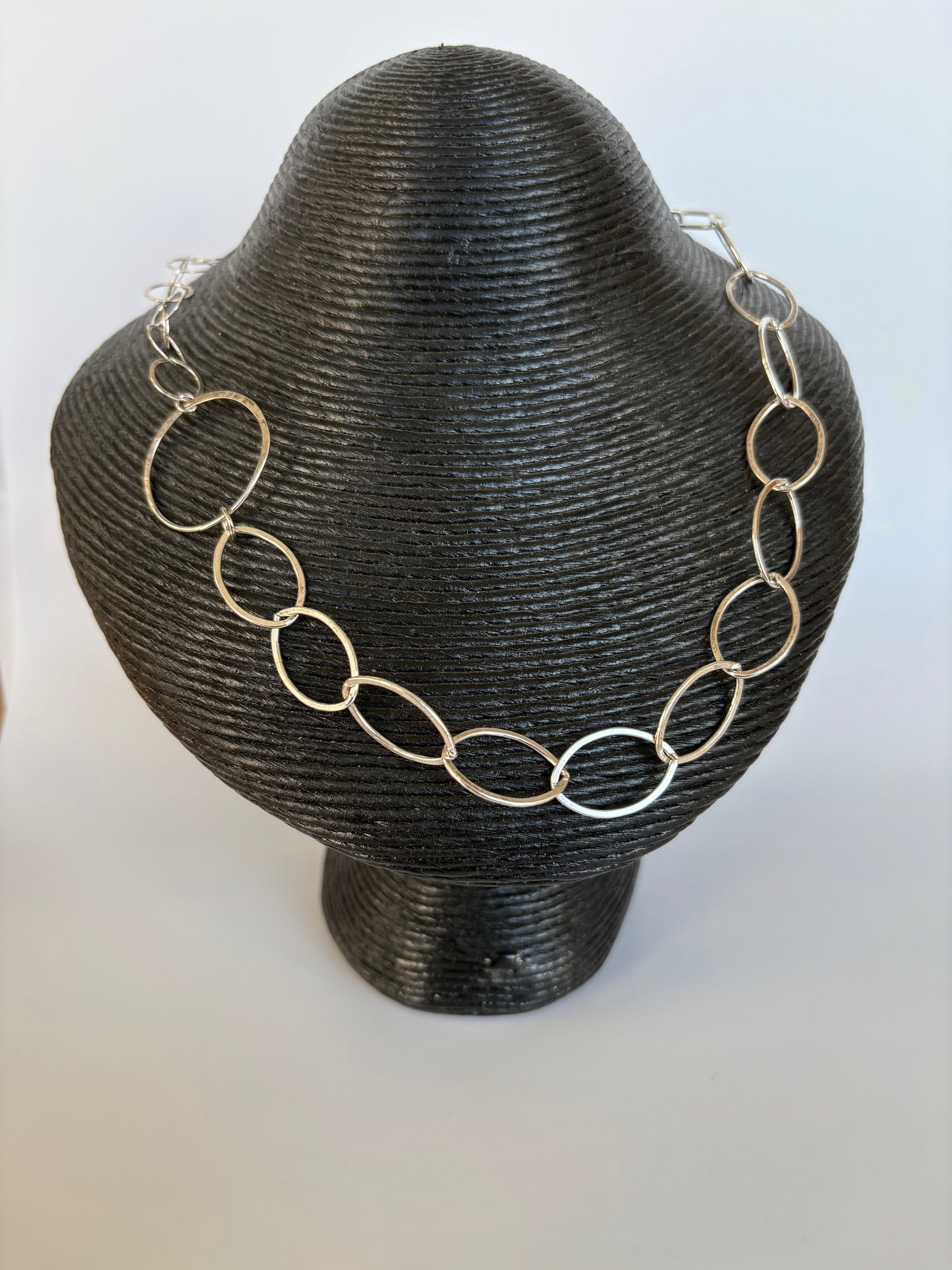 Sterling silver chain necklace on a black mannequin bust against a white background. Jolie Esprit 