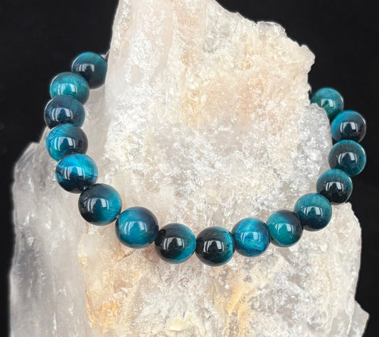 Blue beaded bracelet on a crystal background