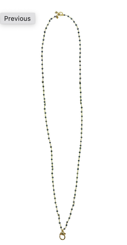 Necklace in spinel and brass with gold clasp on a white background