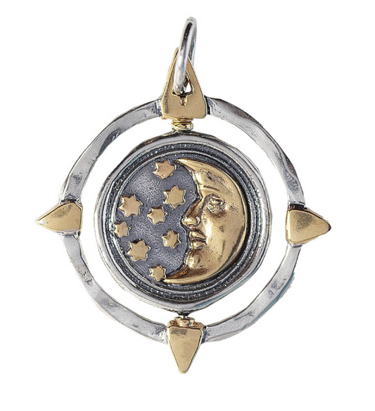 Pendant with moon and star design on a white background