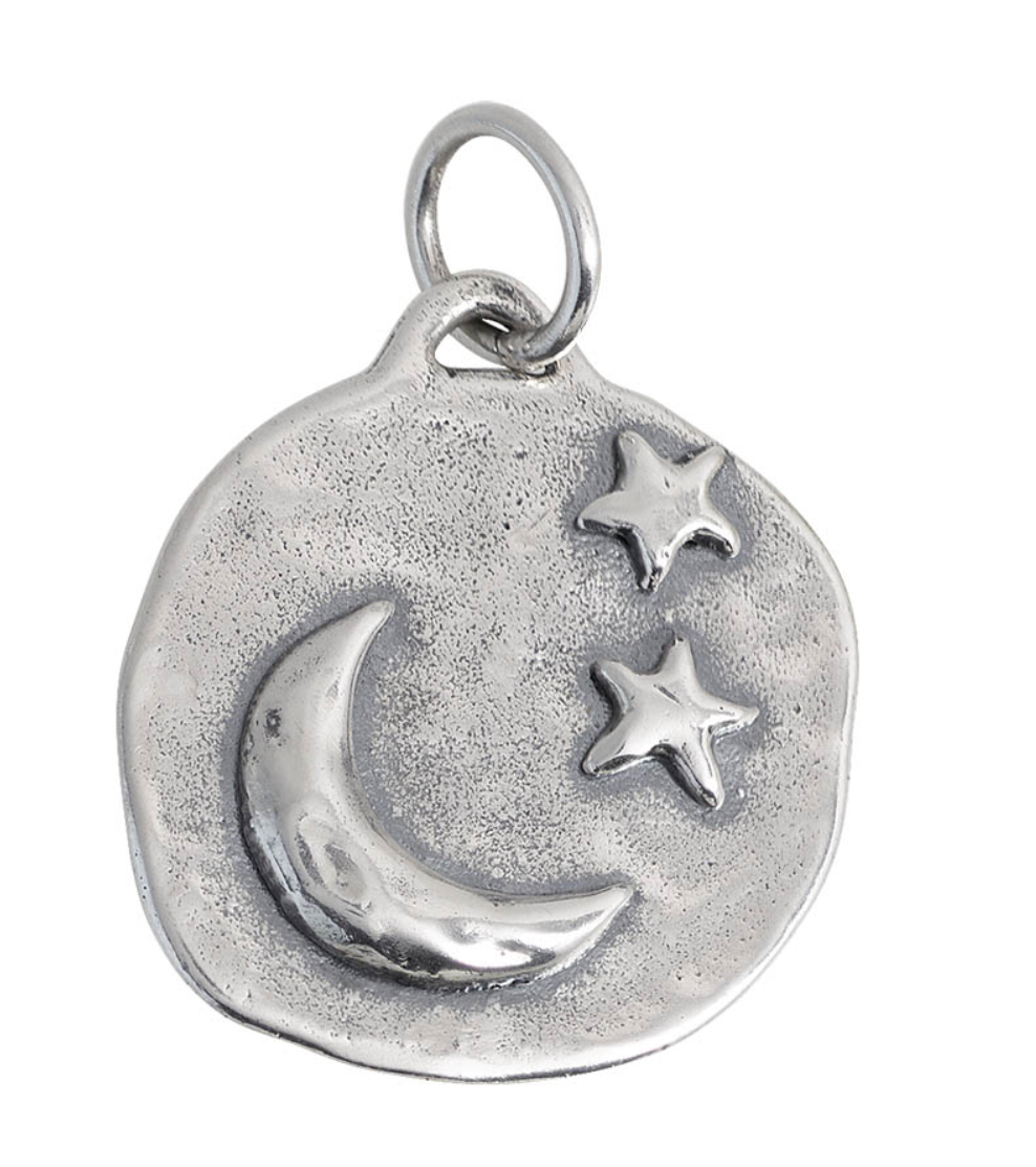 Silver pendant with moon and stars on a white background