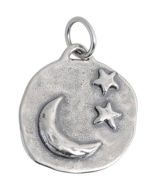 Silver pendant with moon and stars on a white background