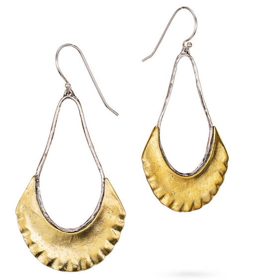 Gold and silver earrings on a white background