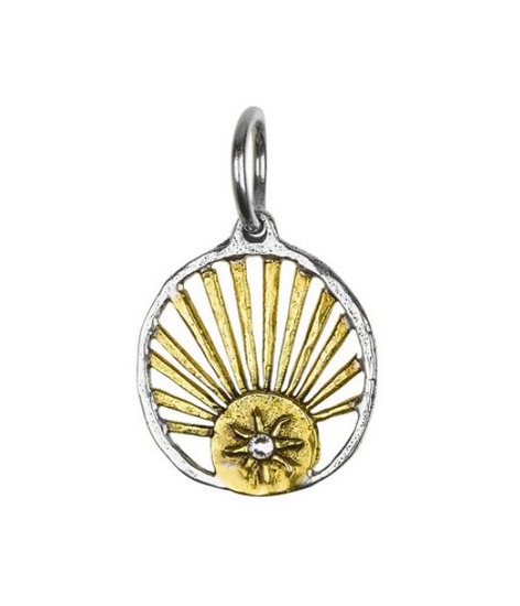 Gold and silver pendant with sunburst design on a white background by Waxing Poetic