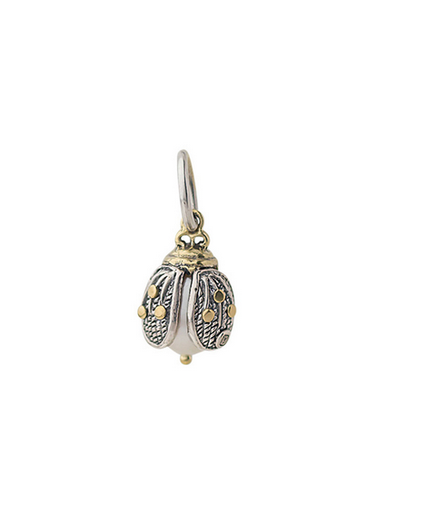 Sterling silver and pearl ladybug charm on a white background. Waxing Poetic
