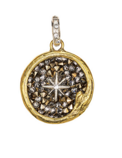 Brassand sterling silver pendant with star design in swarovski crystals on a white background. Made by Waxing Poetic