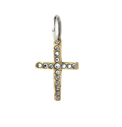 Gold and silver cross pendant on a white background by Waxing Poetic